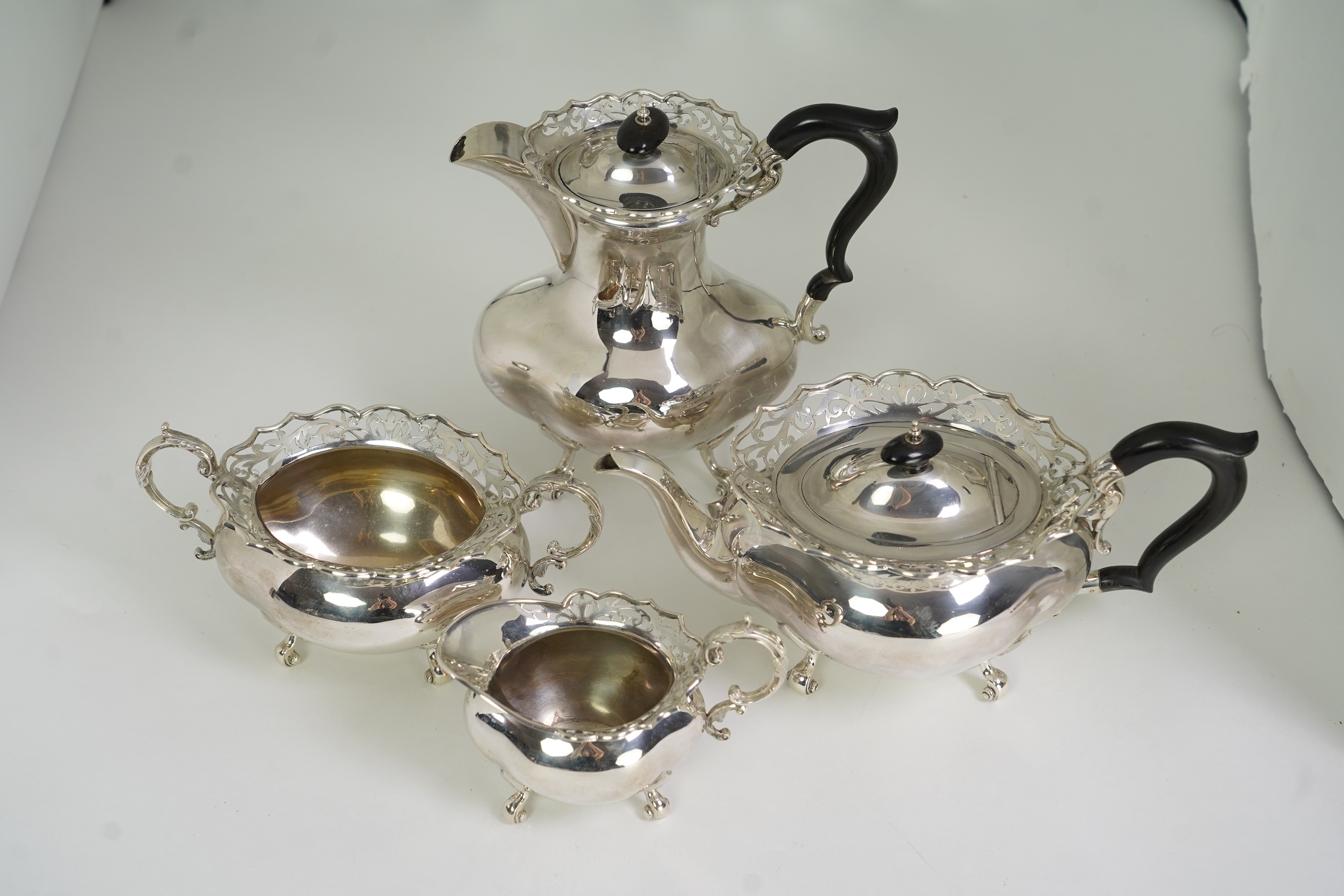A George V silver four piece tea set by James Deakin & Sons Ltd